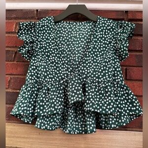 #9)  100% polyester green with white floral ruffle crop top. Excellent